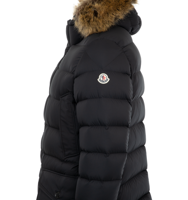 Image 3 of 3 - BLACK - Moncler Clunye Hooded Mid-Length Down Jacket has a detachable and adjustable hood with synthetic trim, a zip and snap button closure, snap pockets, and zip pockets. Lined. Down filled. 100% polyamide exterior. Made in Armenia.  