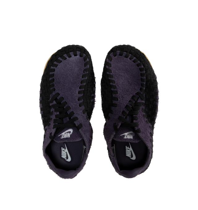 Image 5 of 5 - PURPLE - NIKE Air Footscape Woven Sneakers featuring a blue denim colored textile and soft suede upper, asymmetrical woven details, lateral lacing, foam midsole, Nike Air cushioned heel and rubber outsole. 