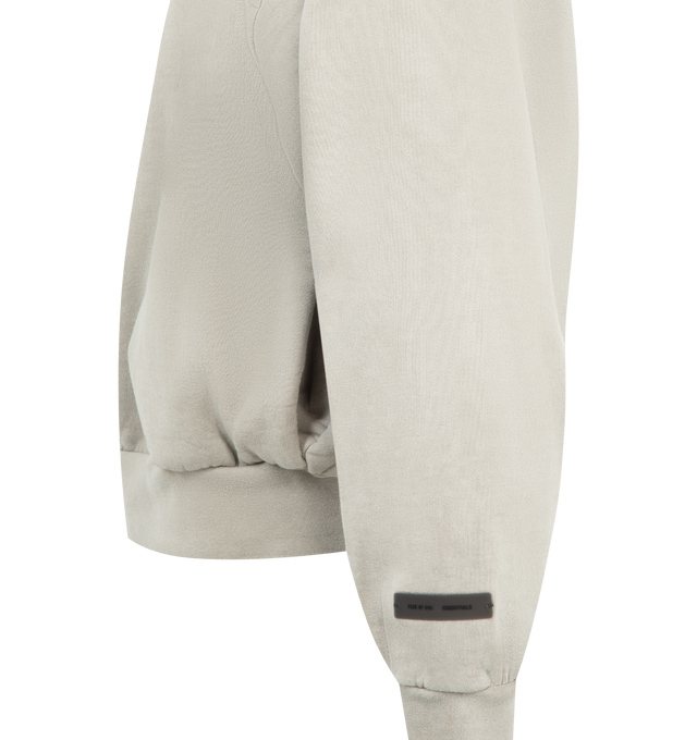 Image 3 of 3 - GREY - FEAR OF GOD ESSENTIALS Embroidered Classic Full Zip Hoodie featuring 520gsm heavy fleece treated with a pigment dye, classic silhouette, embroidered Fear of God Essentials logo on the back, side pockets, rib-knit cuffs and waist-hem and a Fear of God Essentials rubberized label stitched at the back collar. 100% cotton. 