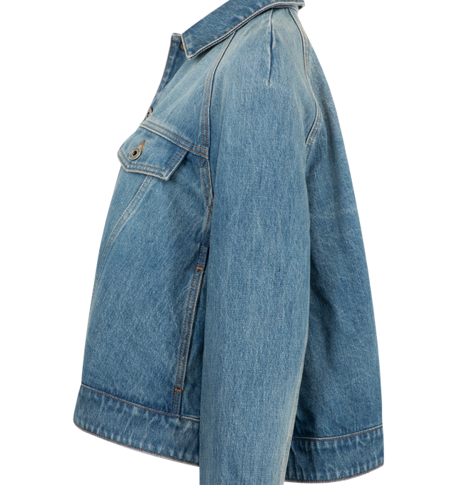 Image 3 of 3 - BLUE - LOEWE Trapeze Jacket in medium-weight cotton denim featuring a trapeze silhouette with raglan sleeves, regular fit, short length, classic collar, button front fastening, buttoned cuffs, buttoned chest patch pockets, seam pockets and LOEWE Anagram embossed leather patch placed at the back. Cotton. Made in Italy. 
