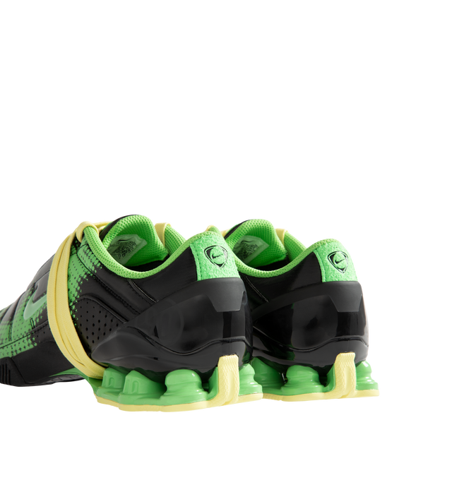 Image 3 of 5 - GREEN - Nike Women's Total 90 Shox Magia Sneakers feature a premium nubuck leather upper with oversized laces and printed graphic detailing, combining the iconic design of the Total 90 with a sleek, tonal finish. Inspired by early-2000s soccer style, these lifestyle sneakers pair signature Nike Shox cushioning with a durable rubber outsole for responsive comfort and everyday wear. Main Material: Nubuck Leather. Midsole: Nike Shox. Sole: Rubber.  
