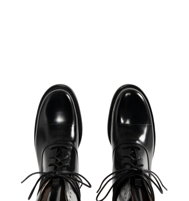 Image 4 of 4 - BLACK - THE ROW Kai Lace Up Boot featuring lace-up ankle boot in glossy calfskin leather with elongated round toe, extended leather sole and stacked leather heel. 100% calfskin leather. Leather sole. Made in Italy. 