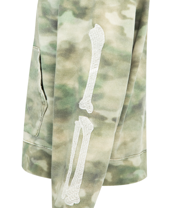 Image 3 of 3 - GREEN - AMIRI Bones Oversized Camouflage Hoodie featuring logo-embroidered, kangaroo front pocket, ribbed trims and bone embellishment. 100% cotton. Made in Italy. 