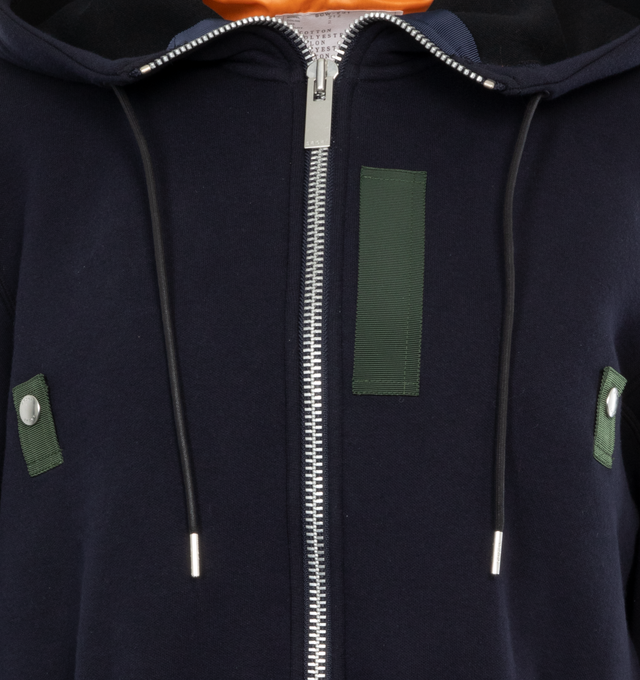 Image 4 of 4 - NAVY - SACAI Sponge Sweat Hoodie featuring drawstring at hood, funnel neck, two-way zip closure, rib knit hem and cuffs and logo-engraved silver-tone hardware. 62% cotton, 38% polyester. Trims: 100% nylon. Made in Japan.  