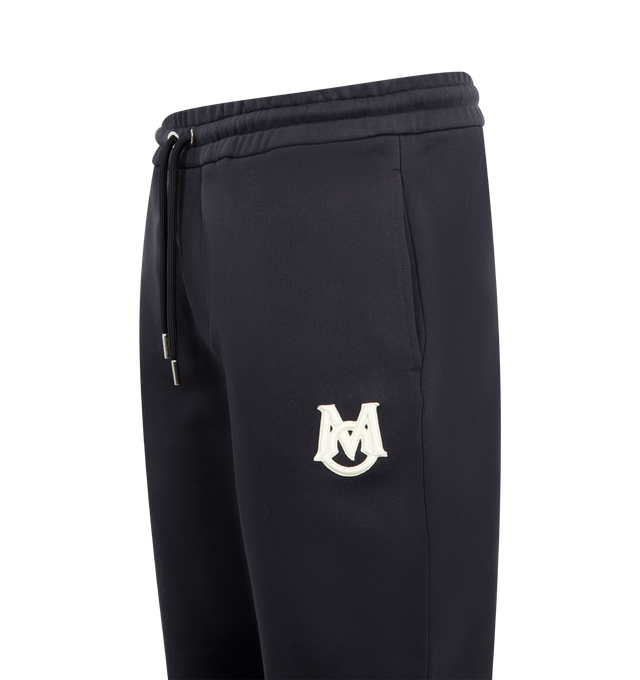 Image 3 of 4 - NAVY - MONCLER Sweatpants featuring elastic waistband with drawstring fastening, side slit pockets, back welt pocket, elastic hem, logo on back and front leg. Cotton.  