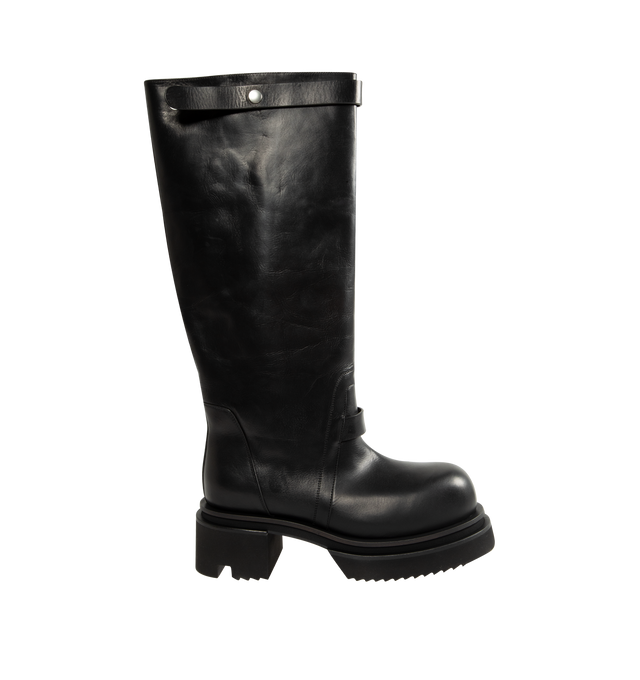 Image 1 of 4 - BLACK - Rick Owens Men's Naska Bogun Boots are crafted from washed calf leather and feature an under-the-knee silhouette with a wide shaft, a snap-fastening strap at the top, rounded toes, a geometric heel counter, and a Bogun rubber mega creeper sole with a toothed square heel. Main Material: 100% Calf Leather. Lining: 100% Calf Leather. Insole: 100% Calf Leather. Height: Under the Knee. Made in Italy. 