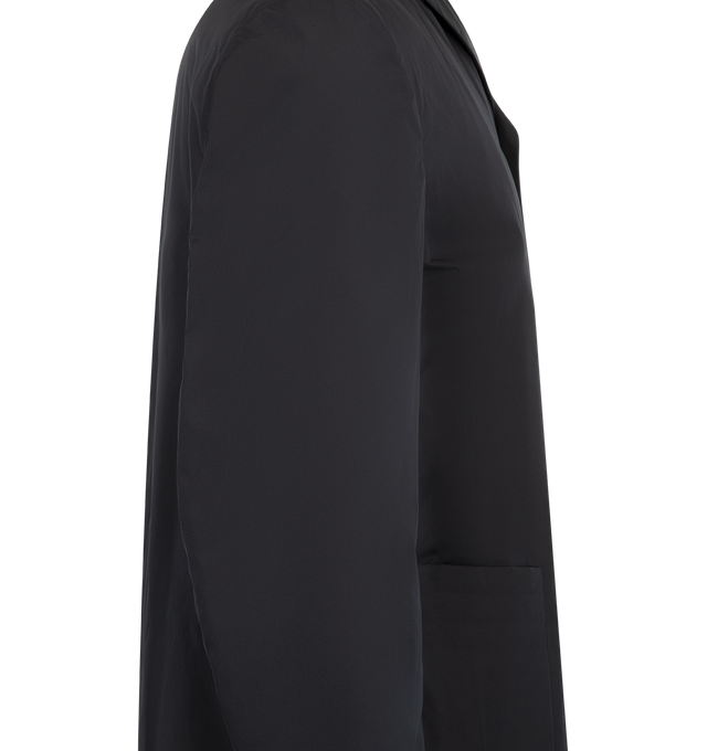 Image 3 of 3 - BLUE - Jil Sander Mens Sport Jacket is a Single-Breasted Tailored Jacket is crafted from lightweight technical fabric. Features a relaxed fit, notched lapels, button-front closure, long sleeves, two front patch pockets, and a straight hem. Main Material: 100% Polyester. Made in Italy. 