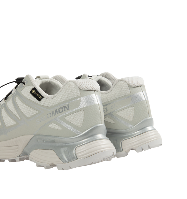 Image 3 of 5 - WHITE - Salomon XT-Pathway GTX Sneakers  are a lace-up style with a quickLACE system, ACS stability, Mud Contagrip chevron rubber lug outsoles, anti-debris interior mesh, synthetic uppers, textile linings, lace pockets, protective toe caps, protective mudguards, OrthoLite die-cut sock liners, and GORE-TEX waterproofing. Unisex style in men's sizing. 