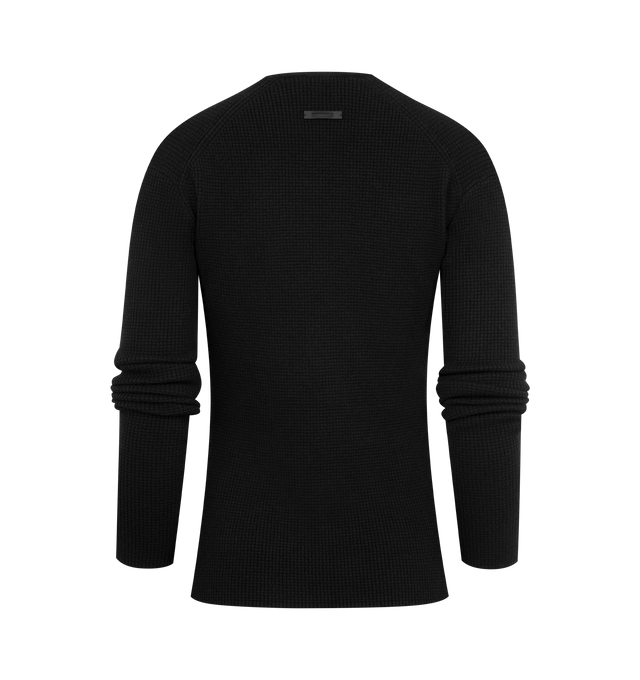 Image 2 of 2 - BLACK - FEAR OF GOD ESSENTIALS Waffle Long Sleeve Top featuring a poly-nylon waffle knit, form-fitting silhouette, rib-knit crewneck and a Fear of God Essentials label positioned at the back. 88% polyester, 12% nylon waffle knit. 
