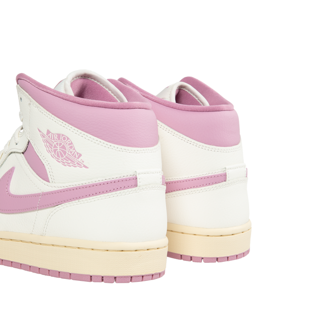 Image 3 of 5 -  PINK - JORDAN Air Jordan 1 Mid-top lace-up sneakers featuring premium leather and synthetic upper provides durability, comfort and support. Air-Sole unit in the heel delivers signature cushioning. Rubber outsole offers traction on a variety of surfaces. 