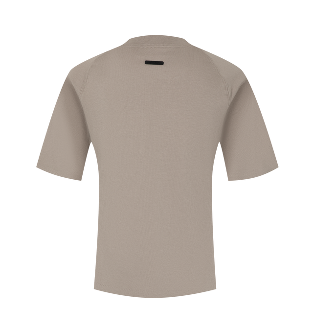 Image 2 of 2 - NEUTRAL - Fear of God Essentials Womens Shrunken Baseball Tee is crafted from lightweight tri-blend jersey. Features a slim cropped fit, rib-knit crew neckline, raglan short sleeves, and signature Essentials label at the back collar. Main Material: 53% Cotton, 40% Polyester, 7% Rayon. 
