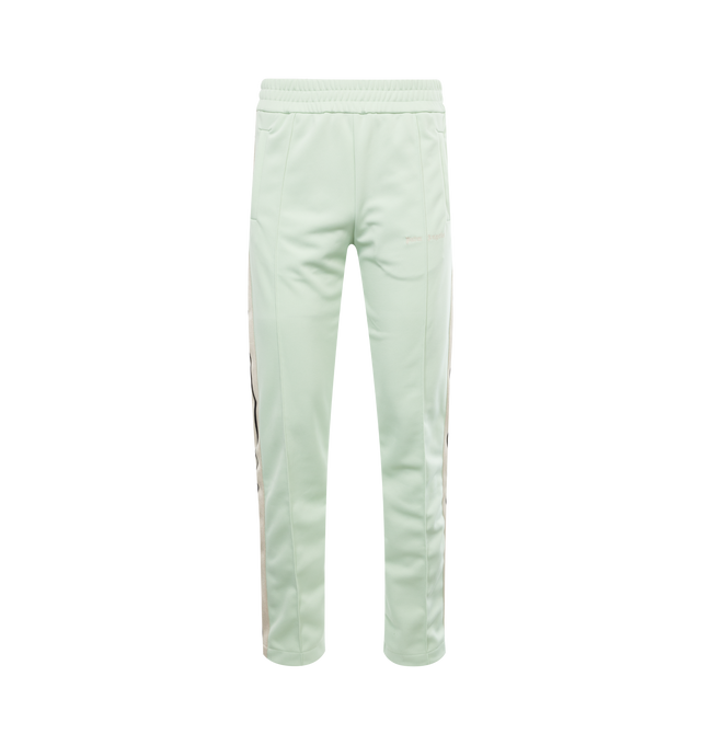 Image 1 of 3 - GREEN - PALM ANGELS CLASSIC LOGO TRACK PANTS with elastic waistband, ecru side bands and vertical pockets, ankle zippers and white embroidered logo at the front thigh. 100% polyester.  