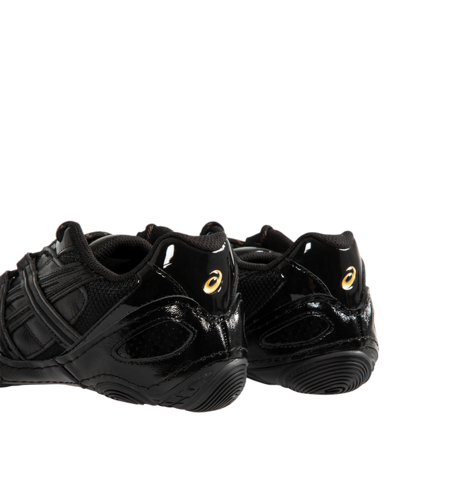 Image 3 of 5 - BLACK - Asics Hypersync Sneakers are inspired by the brand's archived wrestling and track & field footwear, combining heritage design with modern comfort. Featuring a breathable air mesh upper with textured patent leather overlays, decorative stitching, and premium gold logo detailing, these designer sneakers deliver a sleek, low-profile silhouette. Finished with an OrthoLite sockliner for enhanced cushioning, a durable AHARPLUS rubber outsole inspired by the SNAPDOWN wrestling shoe, and a no 