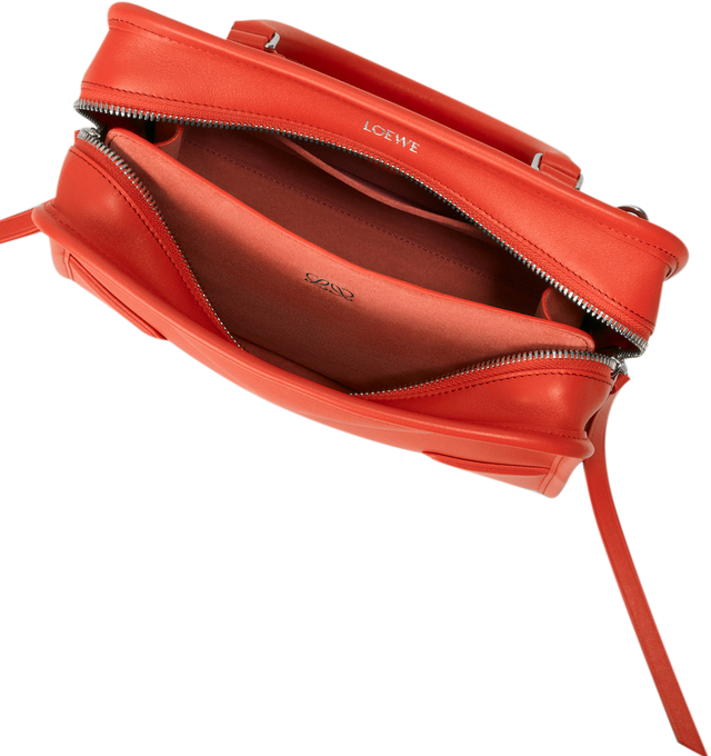 Image 13 of 17 - ORANGE - Loewe Small Amazona 180 Bag in leather features a relaxed silhouette anchored by a single toron top handle, designed to be carried open, while a concealed closure secures the main compartment, three carry options: short handle, removable shoulder strap and crossbody, zip closure with two leather zip pullers, two compartments, main compartment closed with magnetic closure, internal flat pocket, left side d-ring for customization, nappa lambskin lining, and embossed double L branding 