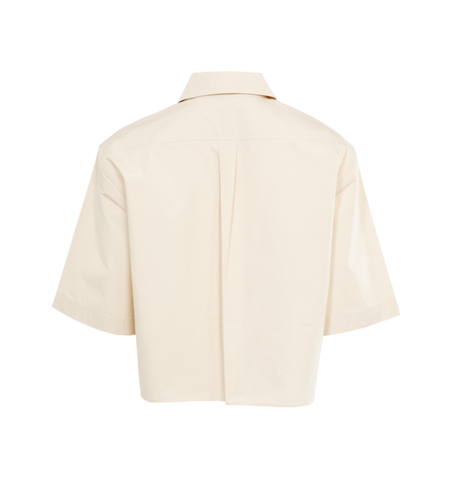 Image 2 of 3 - WHITE - TOTEME Cropped Cotton Poplin Shirt featuring a wide, cropped silhouette, light organic-cotton poplin with a concealed button placket and a neat box pleat running down the back. 100% organic cotton. 