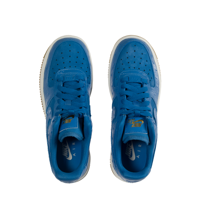 Image 5 of 5 - BLUE - NIKE Air Force 1 snaker crafted from premium leather and textiles, with a foam midsole and rubber sole. Featuring Star Blue ostrich-textured leather upper, Metallic Gold graphics,  padded collar,  gum outsole with Nike Air cushioning for lightweight, all-day comfort. 
