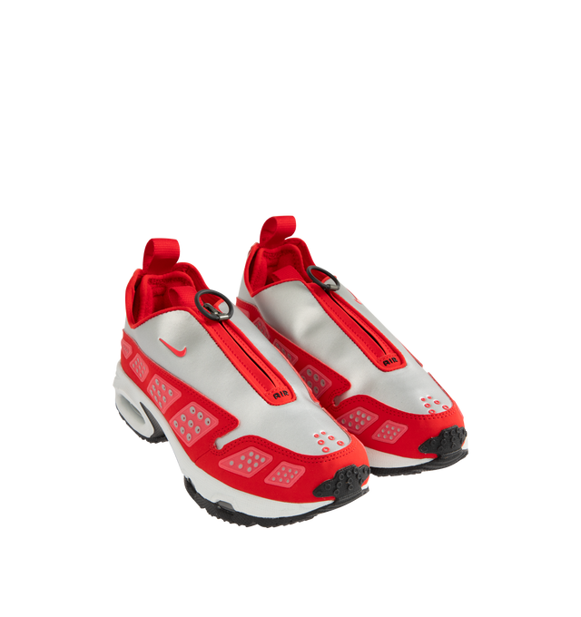 Image 2 of 5 - RED - NIKE Air Max SNDR Sneaker featuring Air cushioning in the heel and forefoot for exceptional bounce and comfort, unzip the shroud to reveal "6453," waterproof GORE-TEX fabric, reflective panels, foam midsole and rubber outsole. 