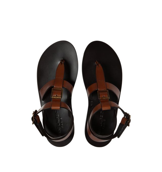 Image 4 of 4 - BROWN - Saint Laurent leather sandals featuring 5 mm flat heel, thong strap with buckle accent, adjustable ankle strap with a leather outsole. Made in Italy. 
