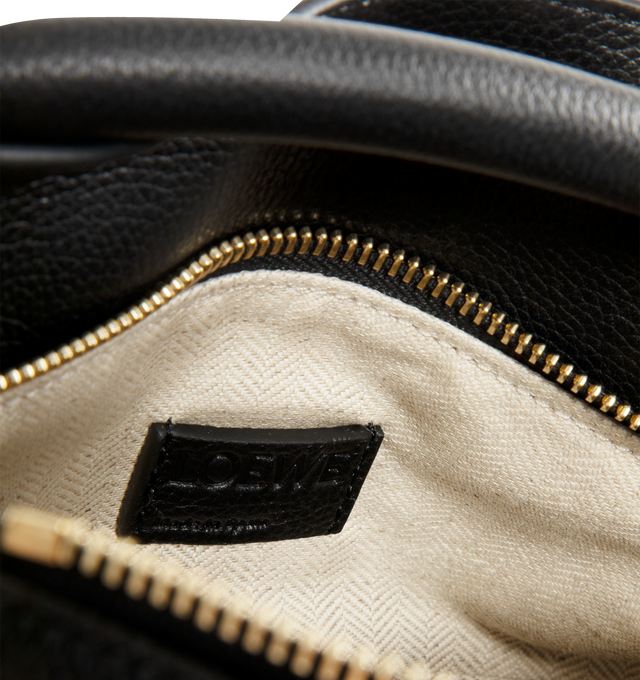 Image 3 of 3 - BLACK - LOEWE Small Puzzle Edge Bag in soft grained calfskin featuring geometric lines, cuboid form, overlapped panels with single stitch lines, shoulder, crossbody or hand carry, detachable and adjustable strap, zip closure with calfskin pull, one external zip rear pocket, one internal slip pocket, herringbone cotton canvas lining and embossed Anagram. Soft grained calf. 16.5 cm x 24 cm x 10.5 cm. Made in Spain. 
