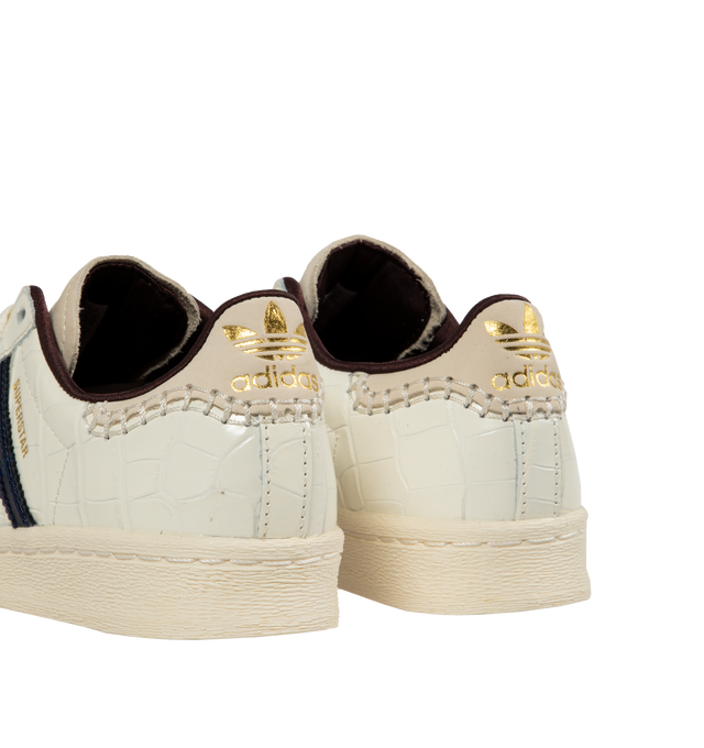 Image 3 of 5 - WHITE - Adidas X Wales Bonner Superstar Sneakers are a lace-up style with croc-embossed leather, signature strips, and rubber soles. 