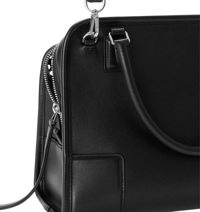 Image 13 of 14 - BLACK - Loewe Women's Medium Amazona 180 Bag is crafted from woven nappa calfskin and features a relaxed silhouette inspired by one of the house's iconic designs. Designed with a single Toron top handle and removable shoulder strap, it can be carried by hand, over the shoulder, or crossbody. A concealed magnetic closure, zip fastening with dual leather pullers, two compartments, an internal flat pocket, and a side D-ring provide functional organization. Finished with palladium-tone hardware 