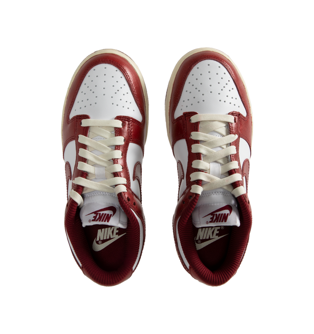 Image 5 of 5 - WHITE - Nike Women's Dunk Low Premium Sneakers have leather uppers, removable insoles, textile linings, and rubber soles.  