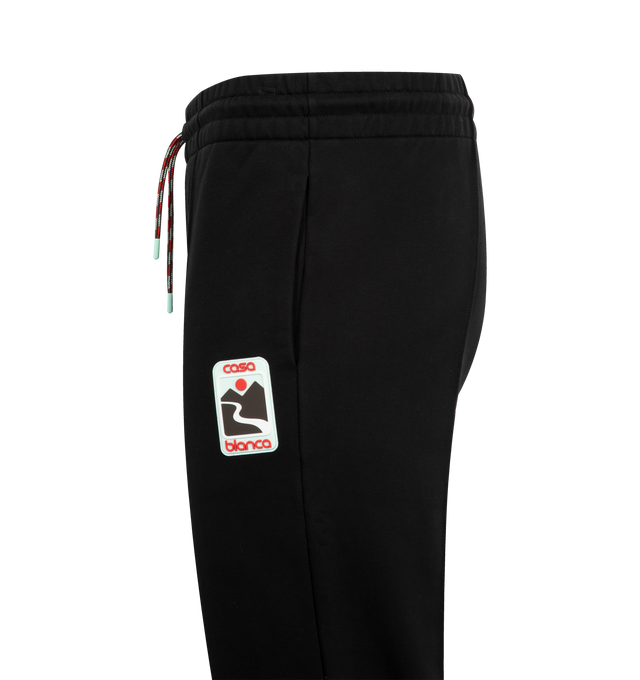 Image 3 of 3 - BLACK - CASABLANCA Sunset Valley Sweatpants featuring a straight-leg design crafted from organic cotton fabric with an elasticated waistband, gold-tipped drawstring fastening, pin-tuck seams down the front, in-seam pockets and a back patch pocket. 100% organic cotton. Made in Portugal. 