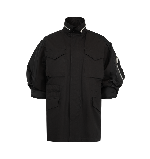 Image 1 of 4 - BLACK - Sacai oversized jacket in cotton weather cloth featuring nylon twill sleeve panels, high stand collar with zipper detail, concealed front closure, flap pockets at the chest and waist, and a sleeve zip pocket. Outer fabric is 100% cotton with 100% nylon sleeves and 100% polyester lining and fill. Made in Japan. 