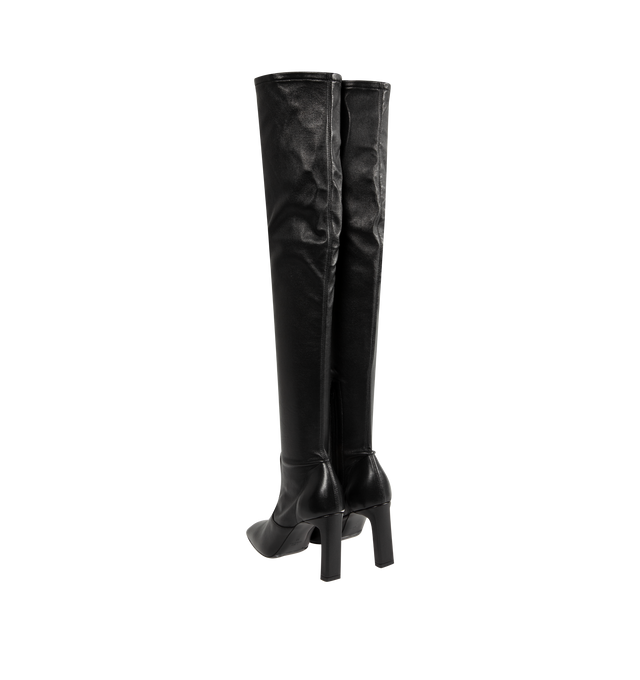 Image 3 of 4 - BLACK - Toteme Women's Nappa Over-the-Knee Boots are crafted from soft stretch Nappa leather and feature a contoured, second-skin silhouette that extends above the knee. Designed with a short side zipper and stretch neoprene lining for a close fit, these designer boots are set on a sculptural bar-shaped, set-back heel and finished with a leather insole and sole. Main Material: 100% Lamb Leather. Lining: 100% Sheep Leather. Sole: 100% Cow Leather. Heel Height: 85 mm / 3.3 in. Closure: Side Zip 
