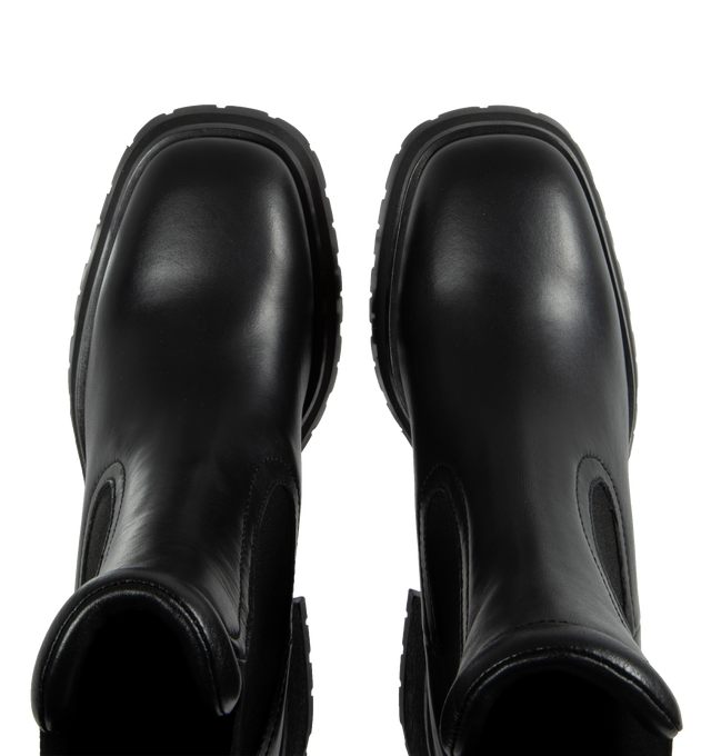 Image 4 of 4 - BLACK - MONCLER Gigi Chelsea Boots featuring a flared heel, logo outline-shaped hardware, leather upper, leather insole, leather-covered welt, l eather-covered heel, micro rubber midsole and rubber tread. Sole height 7 cm. 70% polyester, 30% elastodiene. Leather. Made in Italy. 