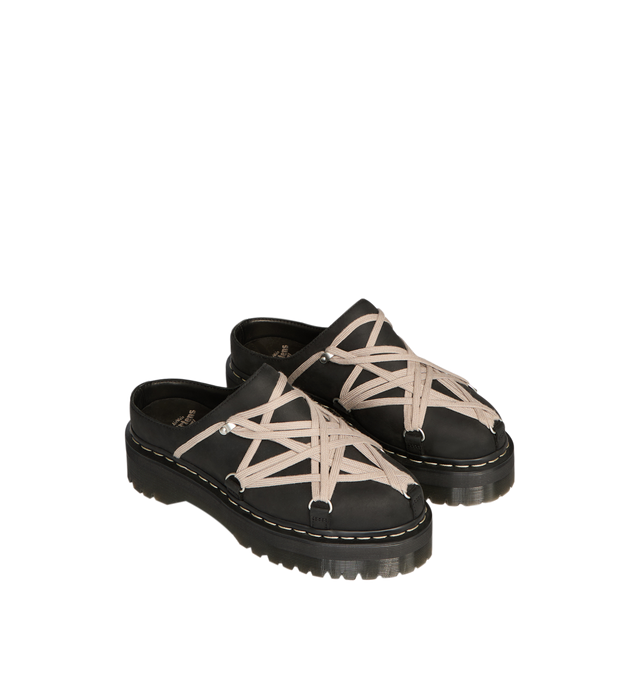 Image 3 of 5 - BLACK - Dr. Martens x Rick Owens FW26 Quad Sole Megalace Mule in Nubuck Leather. These Women's Dr. Martens mules are reimagined by Rick Owens and feature pearl Megalace lacing and palladium-finish hardware, including eyelets and hooks. They are finished with a Quad sole and a yellow and pearl welt stitch. This heavyweight nubuck cow leather has a flat, matte surface finish and an oily handfeel. Material: Upper: 100% Cow Leather; Upper Lining: 100% Cow Leather; Sole: 100% Polyvinyl Chloride. * 