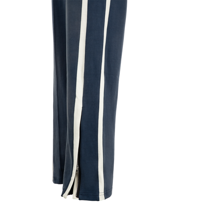 Image 4 of 4 - NAVY - Nahmias Men's Heavy Cotton Track Pant is crafted from cotton and features an elasticized waistband with signature Nahmias drawcords, contrast piping and track stripes along the sides, and zip openings at the hems. Designed and made in Los Angeles, this relaxed track pant combines a worn-in finish with sport-inspired detailing. Main Material: 100% Cotton.  