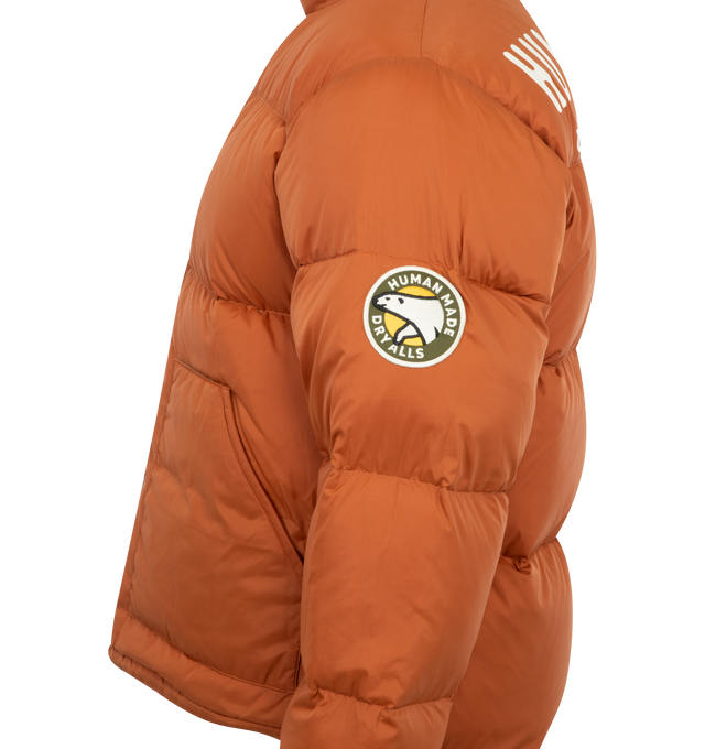 Image 6 of 6 - BROWN - Human Made Down jacket with a voluminous silhouette. The reversible design features a solid color on one side and a crazy pattern on the other, opening up a range of styling options. Material: Nylon. Filling: Down/Polyester. 