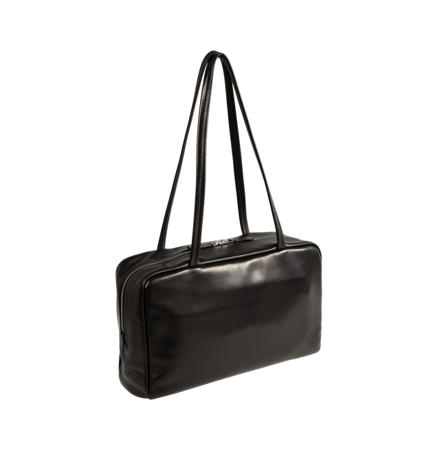 Image 2 of 3 - BLACK - The Row Women's Astra Bowling Bag is crafted from glossy nappa lambskin leather and features a soft bowling bag silhouette with elongated flat handles, turned-edge construction, and a dual zip-top closure. Designed for everyday versatility, this refined carryall is fully lined in lambskin leather and offers ample space for daily essentials while maintaining a sleek, understated profile. Main Material: 100% Lambskin Leather. Lining: 100% Lambskin Leather. Dimensions: 11.81 x 3.94 x 7.0 