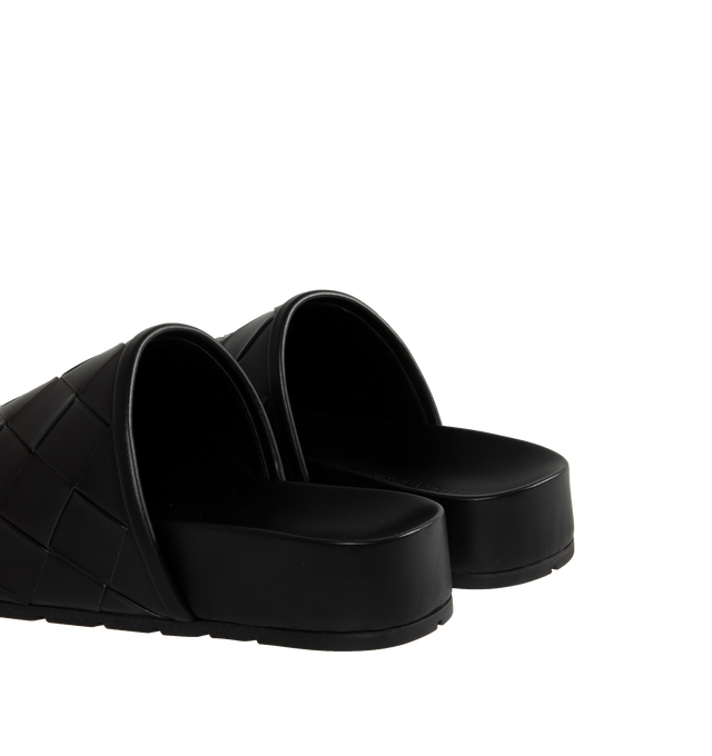 Image 3 of 4 - BLACK - BOTTEGA VENETA Reggie Woven Leather Mule Clogs featuring signature woven intreccio leather, flat heel, round toe, easy slide style and rubber outsole. Lining: leather. Made in Italy. 