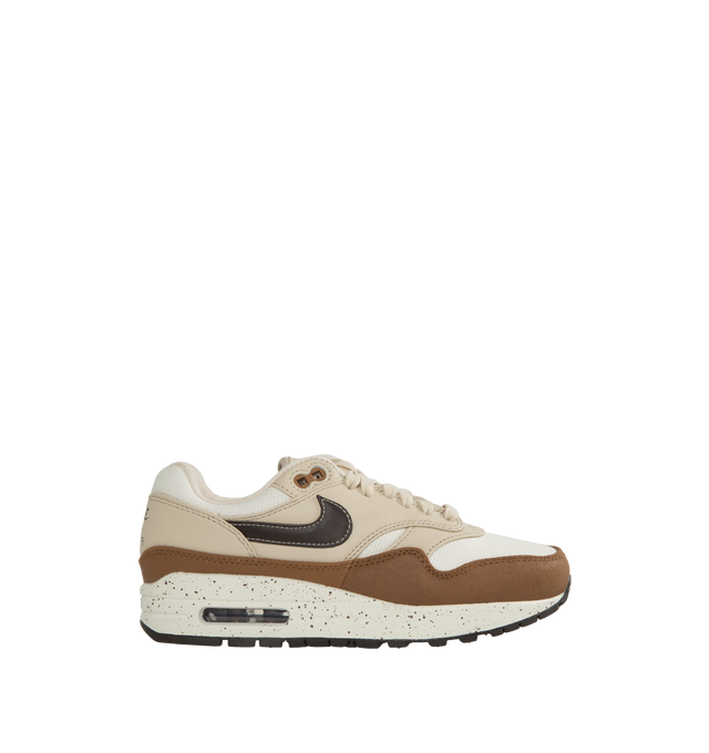 Image 1 of 5 - BROWN - NIKE Air Max 1 '87 Sneakers featuring low-top, canvas, nubuck, and buffed leather, lace-up closure, logo patch at padded tongue, padded collar, swoosh appliqu at sides, logo embossed at heel counter, faux-suede and mesh lining, Air Sole unit at rubber midsole and treaded rubber sole. Upper: textile, leather. Sole: rubber. Made in China. 