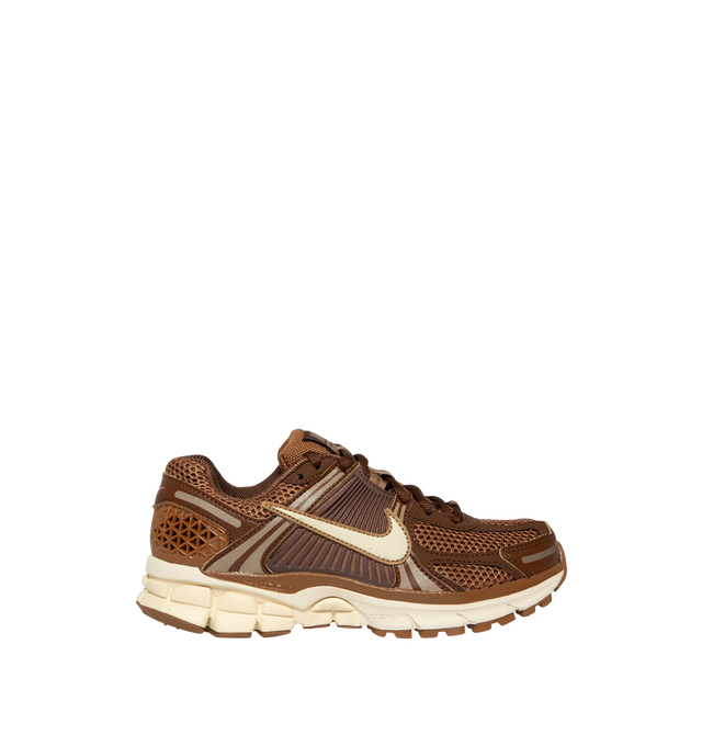 Image 1 of 5 - BROWN - Nike Womens Zoom Vomero 5 Sneakers feature a layered design with textile, synthetic leather, and plastic accents. Finished with Zoom Air cushioning, supportive side caging, reflective details, and a durable rubber outsole. Main Material: Textile, Synthetic Leather, Plastic; Outsole: Rubber. Imported 