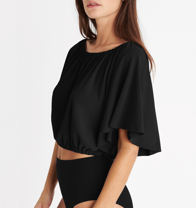 Image 4 of 5 - BLACK - ERES Solal Crop Top featuring elasticated neckline and waist with short butterfly sleeves. 94% Polyamid, 6% Spandex. Made in France. 