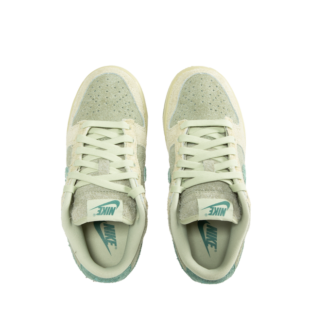 Image 5 of 5 - MULTI - NIKE Dunk Low Sneaker crafted with hairy suede upper in shades of olive aura, bicoastal, and oil green featuring lace-up front, signature Swooshes at sides, embossed Air logo at foxing, perforated toe and padded collar with debossed Nike logo at back counter. 