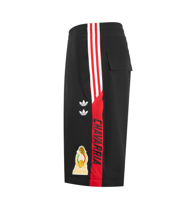 Image 4 of 4 - BLACK - Adidas Mens Convertible Woven Pants feature a woven construction with zip-off lower legs for convertible wear. Designed with an elastic waistband, zip closures at the knees, applied 3-Stripes along the upper and lower legs, embroidered logos and artwork, and side pockets. Made in Indonesia. 
