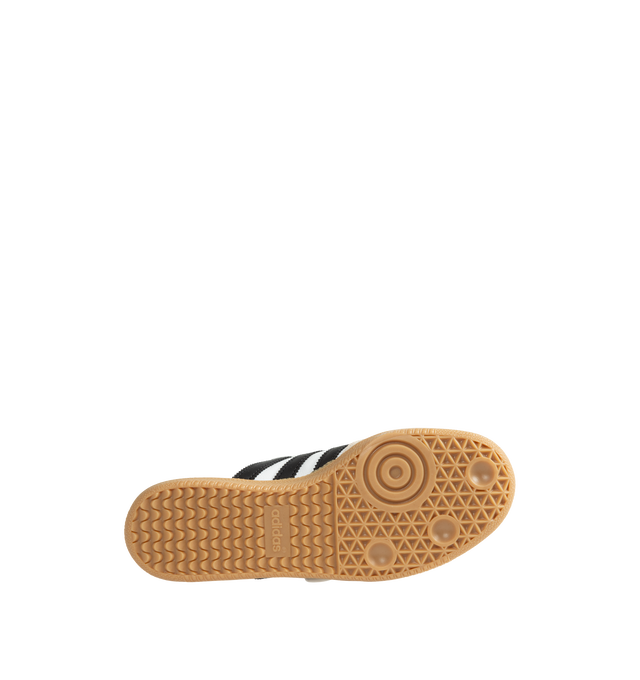Image 4 of 5 - WHITE - Adidas Women's Samba Jane Shoes are crafted from smooth leather and feature a modern Mary Jane-inspired interpretation of the iconic Samba silhouette. Designed with signature serrated 3-Stripes, a low-profile shape, satin lining, and a gum rubber outsole, this style blends the heritage of the original indoor trainer with a contemporary everyday aesthetic.  