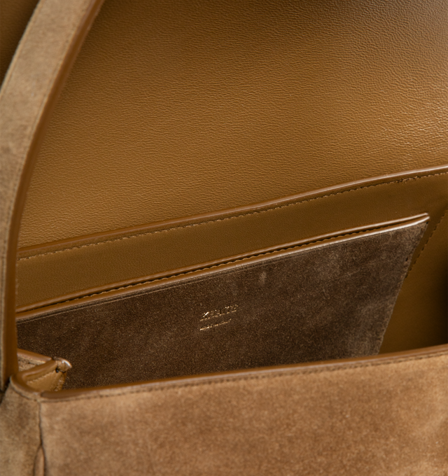 Image 3 of 3 - BROWN - KHAITE Audrey Top Handle Bag featuring a flap-top bag that combines sculptural volume with refined structure, signature Empire hardware at magnetic closure and internal slip pocket. 13.1 in x 7 in x 8.8 in. 100% calfskin. Made in Italy. 