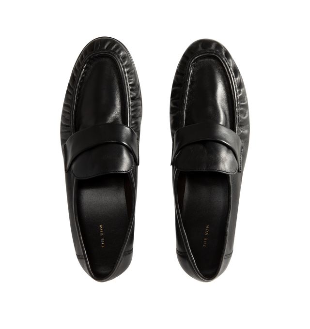 Image 4 of 4 - BLACK - The Row womne's artisanally-crafted loafer in soft nappa leather with natural pleating effect and hand-painted leather sole. 0.75 in. heel. 100% Lambskin Leather. Made in Italy. 