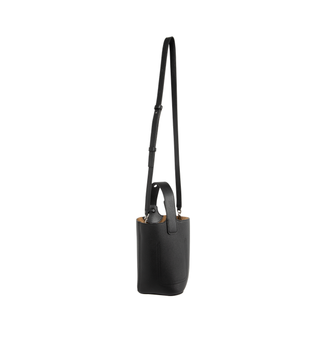 Image 2 of 3 - BLACK - Loewe Pebble is a minimalistic bucket bag with a wide strap adjustable through an oversized Pebble closure. This mini version is crafted in soft grained calfskin.Crossbody, shoulder or hand carry with additional adjustable and removable strap. Features one internal pocket, suede lining, Anagram Pebble. Made in Spain. 