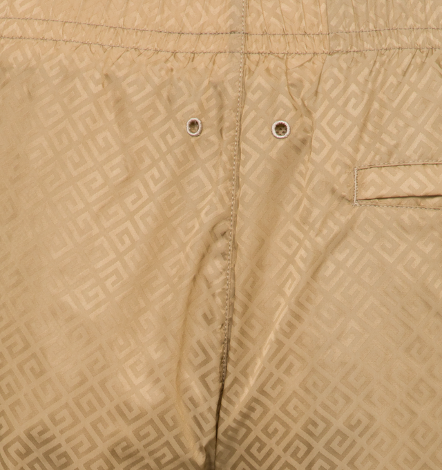 Image 5 of 5 - BROWN - GIVENCHY Long Swim Shorts featuring recycled synthetic fiber, elastic waist, diagonal 4G pattern all-over, small GIVENCHY signature on the left leg, on the front, two side pockets and one back pocket. 100% polyamide. 