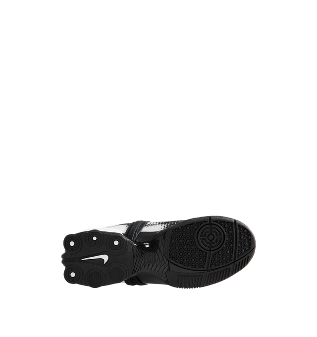 Image 4 of 5 - WHITE - Nike Women's Total 90 Shox Magia Sneakers feature a premium nubuck leather upper with oversized laces and printed graphic detailing, combining the iconic design of the Total 90 with a sleek, tonal finish. Inspired by early-2000s soccer style, these lifestyle sneakers pair signature Nike Shox cushioning with a durable rubber outsole for responsive comfort and everyday wear. Main Material: Nubuck Leather. Midsole: Nike Shox. Sole: Rubber.  