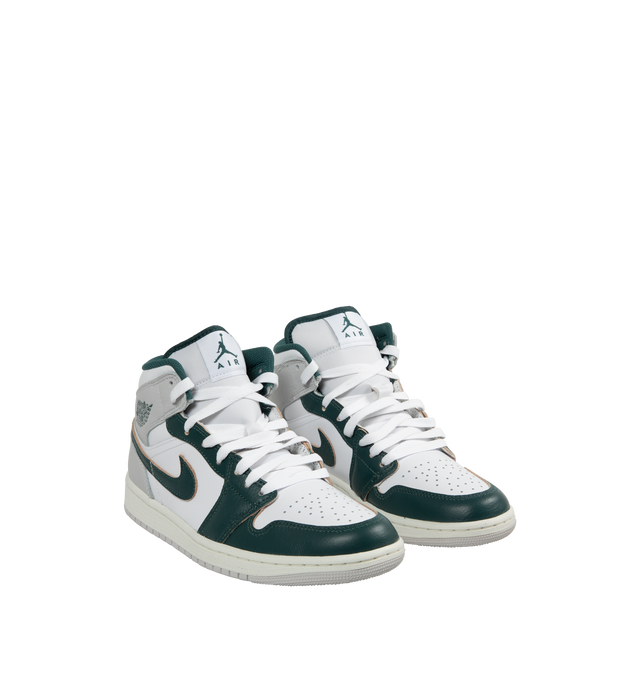 Image 2 of 5 - MULTI - AIR JORDAN 1 MID SE basketball shoe in White, Oxidized Green, Sail, and Neutral Grey leather upper featuring an angled profile, toe box perforations, mesh tongues and lining, encapsulated Air cushioning underfoot, and distinctive Jordan detailing. Air-Sole cushioning provides lightweight, responsive comfort.  Leather and textile upper/synthetic lining/rubber sole. 