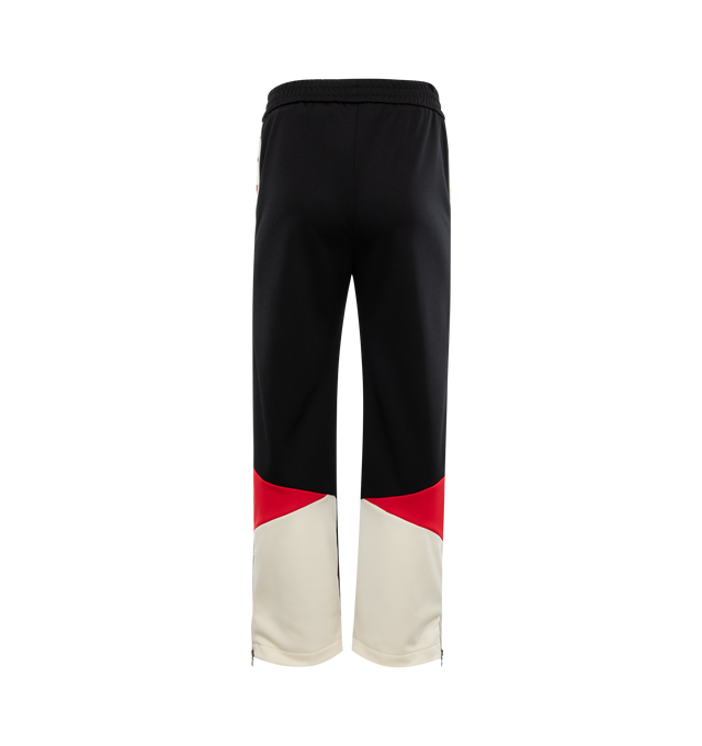 Image 2 of 3 - BLACK - PALM ANGELS Moneygram Haas F1 Team Track Pants featuring elastic waistband, monogram patch on front, colorblocking and stars down leg. 100% polyester.  