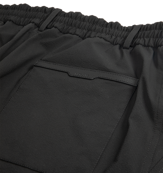Image 3 of 3 - BLACK - MONCLER Seersucker Shorts featuring adjustable waistband, zipper and button closure, back pocket and leather logo patch. 100% polyester. Made in Romania. 