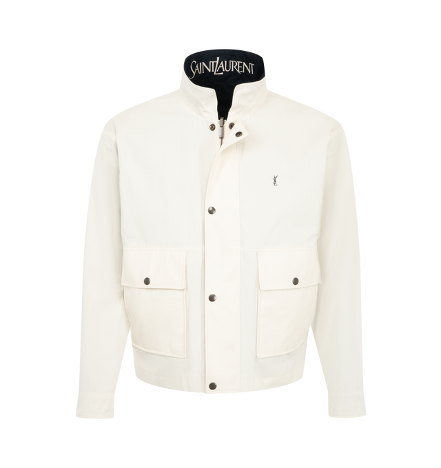 Image 4 of 4 - BLUE - Saint Laurent Mens Reversible Workwear Jacket is crafted from cotton. Features a reversible design, concealed front zip closure with snap-button storm flap, two-way stand collar with embroidered Saint Laurent logo underneath, embroidered Cassandre logo at the chest, snap-button cuffs, two front patch pockets with snap-button flaps, and two welt pockets on both sides. Main Material: 100% Cotton. Made in Italy. 